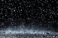 White rain falling background night water.