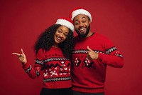 Young couple wearing Christmas sweaters christmas happy santa.