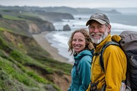 Middle-aged couple hiking adventure outdoors coastal.