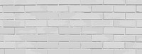 A gray brick background, background with a smooth texture. The background features gray bricks, creating a minimalist style. Brick texture background vector wallpaper