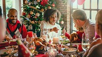 Festive family dinner with diverse group. Christmas tree, holiday meal, and decorations. Joyful gathering, festive atmosphere, and holiday cheer. Celebration, family gathering, festive season.