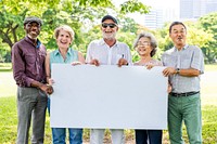 Diverse group of older adults holding a blank sign outdoors. Smiling seniors, men and women, enjoying a sunny day in the park. Diverse, happy seniors gathering in the park holding blank sign.