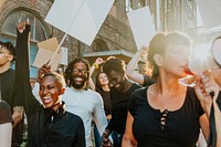 Group of happy diverse people at a protest, holding signs. Diverse people focused on protesting holding signs. Diverse men and women protesting outdoor holding signs. Diverse people protesting outdoor