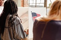 People voting at American election. Diverse people participate in an American election. Civic duty in action at polling stations. Diverse people at election voting box, casting a vote at election