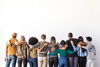 Diverse group of people standing hugging, embracing each other facing away. Unity and diversity. Mixed ethnicities, men and women, embracing diversity and togetherness.