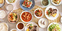 A vibrant spread of diverse dishes middle eastern cuisine, showcasing tacos, salads, and soups. Enjoy the rich flavors of middle eastern food, perfect for gatherings and celebrations.