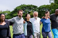 Diverse group of people outdoors, smiling and embracing. Multiracial friends enjoying nature, unity, and friendship. Happy, diverse, and connected group. Diverse community group, volunteers in nature.