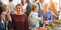 Group of diverse people at a buffet event, enjoying food and conversation. Social gathering with food, drinks, and diverse attendees in a lively setting. Diverse people mingle at a social event.