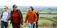 Diverse group of friends hiking outdoors, diverse friends enjoying nature. Smiling hikers, scenic view. Happy hikers, diverse group, outdoor adventure. Hiking, nature. Diverse women and men hiking