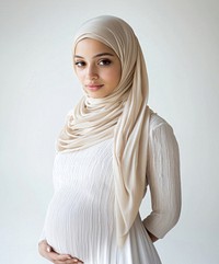 Portrait of pregnant mixed race muslim woman wearing hijab clothing scarf photo.