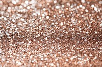 A shimmering rose gold glitter texture background sparkling metallic.