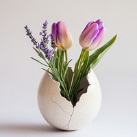 Spring tulips and lavender sprigs cracked flowers vase.