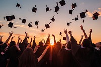 Happy students celebrating graduation throwing.