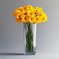 Yellow flowers bouquets glass vase arrangement.