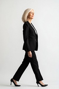 Senior woman walking suit professional.