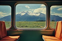 Train interior window mountains scenery nature.