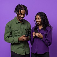 An isolated black man wearing green shirt with a black woman wearing purple shirt playing his phone with smile background clothing person.