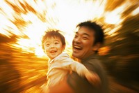 Father with son outdoors happy photo.