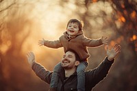 Happy father and son background outdoors photo.