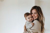 Mother hugging her baby smile happy photo.