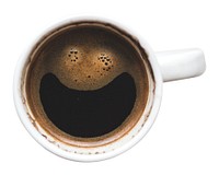 Top view of a coffee cup with a smiley face pattern. Coffee smiley face, coffee art, coffee cup. Enjoy a smiley coffee moment with this unique coffee art. Drink and beverage element isolated on white.