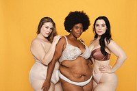 Three women in lingerie pose confidently, embracing body positivity and diversity. They have different body types and styles. Diverse women in lingerie, body positivity and inclusivity.