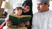 A family reading together. A child, mother, and father focus on a book. The family shares a moment of learning and bonding, highlighting cultural traditions. Muslim family reading the quran together.