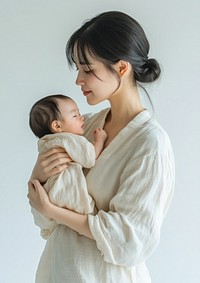 Chinese mother holding newborn baby photo face.