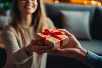 Present smiling ribbon giving.