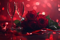 Champagne glasses and ribbons on the table roses background romantic.