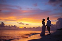 Couple waking photography sunset beach.