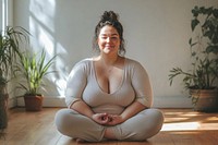 Plussize caucasian woman yoga sitting plants.