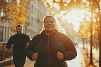 Plussize woman jogging sunlight autumn.