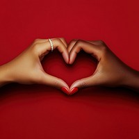 Two diversity hands forming a heart ring background symbol.