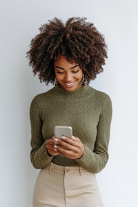 Black woman looking at phone sweater smile happy.