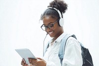 A young Black woman wearing glasses and headphones is smiling backpack tablet casual.