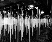 Hangers for buckets holding spent fuel assemblies in the Idaho Chemical Processing Plant fuel storage building canal. Circa 1964. Original public domain image from Flickr