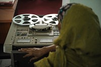 One of Radio Mogadishu's employees works a machine used to convert the archive's analog recordings into digital files on November 7 in Mogadishu, Somalia.