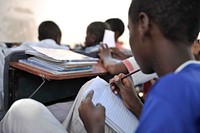 A young boy takes notes during a class session at the Somali Orphans & Disabled Homeless & Children Center in Taleeh Mogadishu.