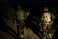 AMISOM soldiers moving through a thicket during a cordon and search operation early in the morning in Madina area of Wadajir district in Mogadishu, Somalia. Original public domain image from Flickr