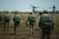 U.S. Army special operations forces walk to a Marine Corps MV-22 Osprey tiltrotor aircraft to conduct a high-altitude, low-opening jump with Philippine and Australian special operations forces May 7, 2014, during Balikatan 2014 at Fort Magsaysay, Philippines.