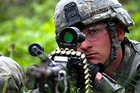 U.S. Army Pfc. Darren P. Ziolkowski, a paratrooper with Bravo Company, 2nd Battalion, 503rd Infantry Regiment, 173rd Airborne Brigade Combat Team, provides security after reacting to indirect fire May 4, 2014, during a situational training exercise as part of Rock Proof in Postojna, Slovenia.