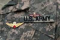 Airborne troops from 1st Battalion, 503rd Infantry Regiment, Vicenza, Italy, receive the Canadian and Latvian parachutist wings. Original public domain image from Flickr