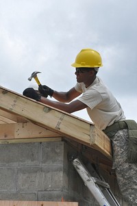 Army engineers construct a buildingArmy engineers construct a building. Original public domain image from Flickr