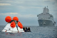 U.S. Sailors assigned to the amphibious transport dock ship USS Anchorage (LPD 23) and Navy divers assigned to Explosive Ordnance Disposal Mobile Unit (EODMU) 11, Mobile Diving and Salvage Company 11-7, participate in the second underway recovery test for the NASA Orion Spacecraft Program Aug. 3, 2014, in the Pacific Ocean off the San Diego coast.