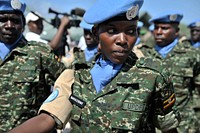 United Nations Guard Unit female soldier Nakazibwe matching during the Inauguration of the United Nations Guard Unit in Somalia on 18th May 2014. The unit comprises of 19 female soldiers. AU UN IST PHOTO/David Mutua. Original public domain image from Flickr