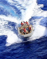 U.S. Sailors assigned to the amphibious transport dock ship USS Mesa Verde (LPD 19) maneuver a rigid-hull inflatable boat during a rescue and assist drill in the Gulf of Aden May 24, 2014.