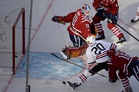 Chicago’s Brandon Saad, bottom front, ties the game at 2-2 behind Washington goalie Braden Holtby ‘s back during the 2015 Winter Classic at Nationals Park in Washington D.C. Jan. 1, 2015.