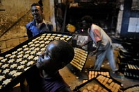 Bakers prepare biscuits ahead of Eid al-Adha in the Hamar Weyne district of Mogadishu, Somalia, on October 3. AMISOM Photo / Tobin Jones. Original public domain image from Flickr