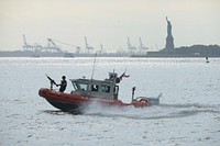 U.S. Coast Guardsmen assigned to Maritime Safety and Security Team (MSST) Boston conduct security sweeps of New York Harbor Sept. 11, 2014.